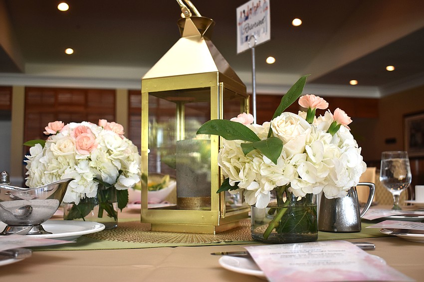 Floral centerpieces adorned each table.
