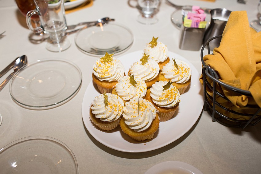 Shining star cupcakes decorated the tables for dessert.