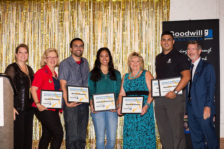 VP of Foundation Veronica Brandon Miller and 2018 Shining Star Award Winners Jackie Simmons, Marcel Bauduin, Ashley McConnell, Stella McDaniel and Steve Garcia with CEO and President Bob Rosinsky