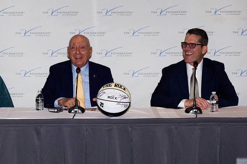 Dick Vitale and Jim Harbaugh at the press conference.