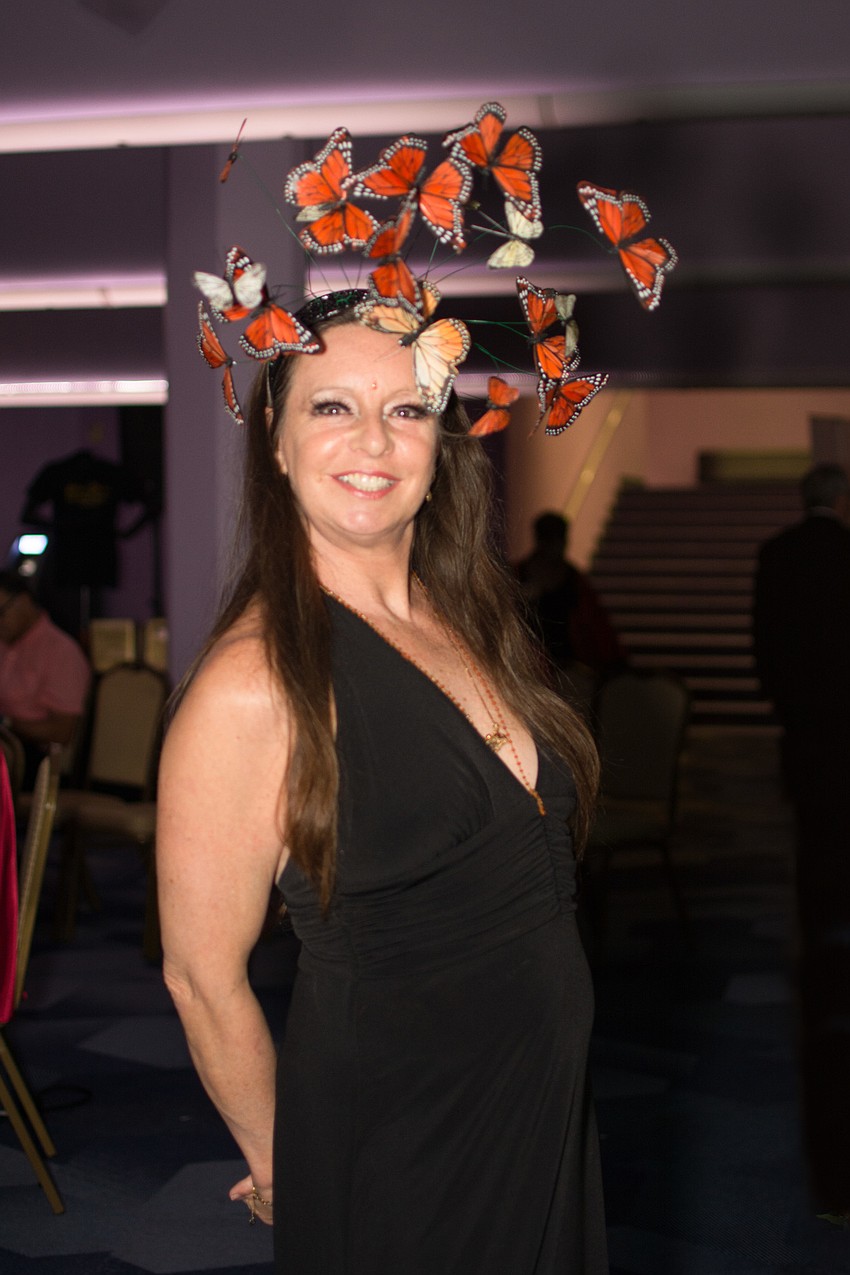 Amanda Marie Mason arrives in a butterfly-inspired look.