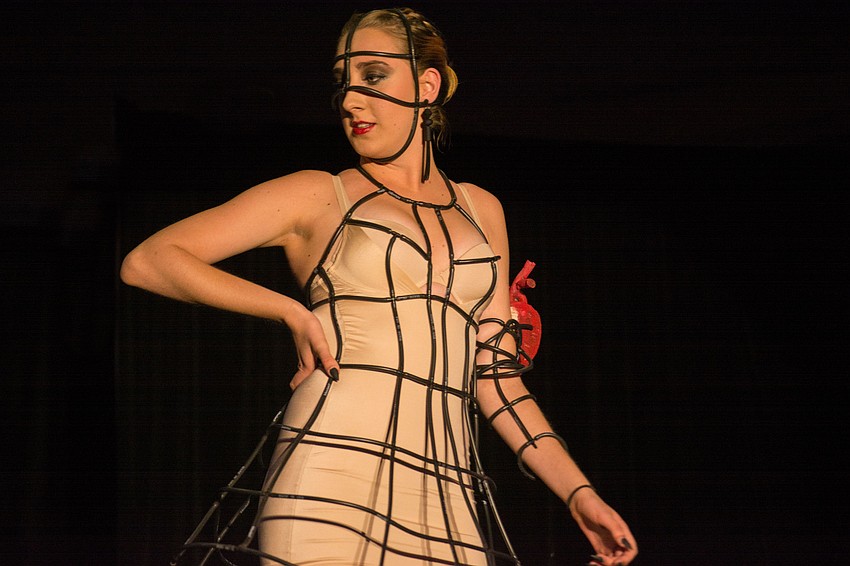 Maezi Kegerreis models a look made out of black vinyl sprinkler tubing by designer Traci Kegerreis.