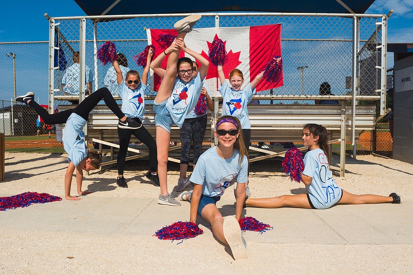 Lily Greene, Jada Lyn, Rachel Greise, McKaylee Kennedy, Layla Haarer, Mya Rodriguez and Kala Henley cheer for the Toronto Blue Jays.