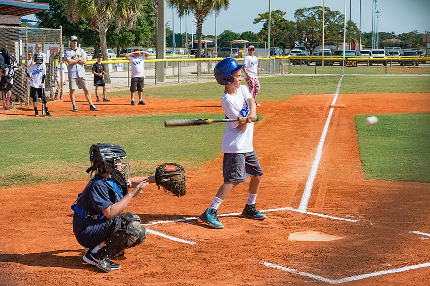 Joseph Derosa takes a swing.