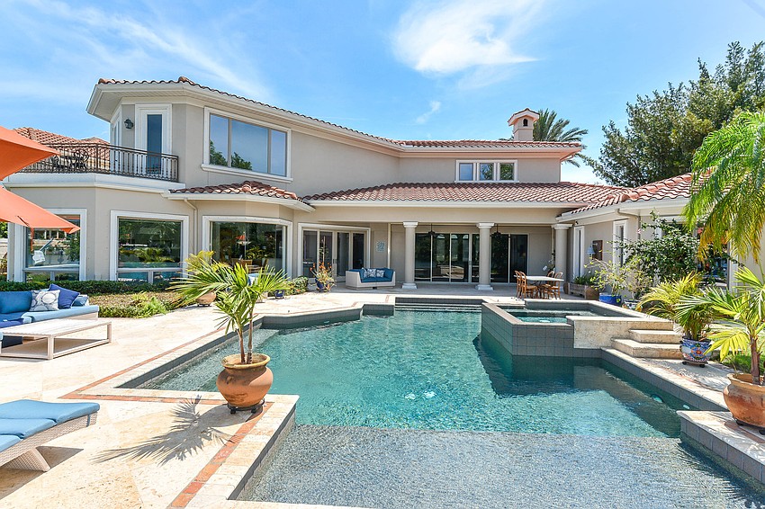 Several rooms in the house overlook the pool area.