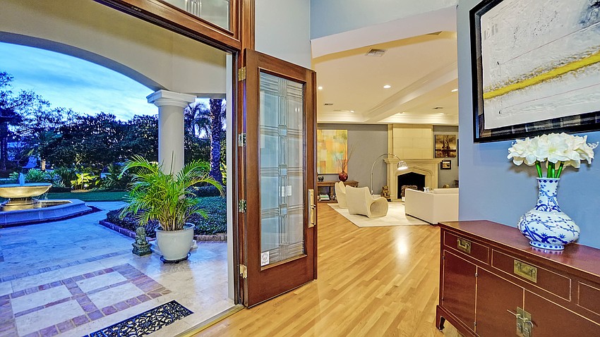 French doors open to receive visitors.