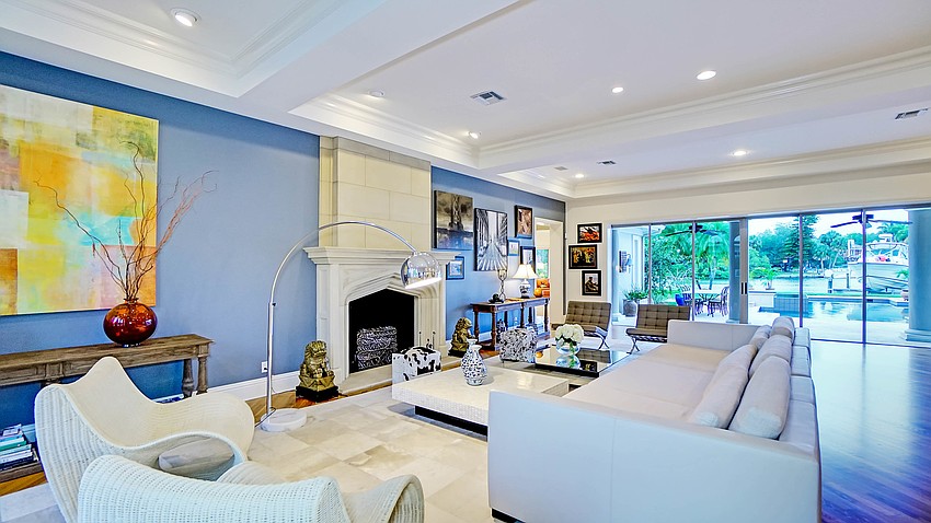 The kitchen opens to views of the backyard.
