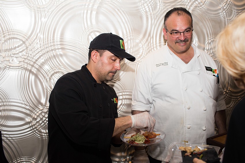 Nauricio Londrno serves guests from Michael's On East.