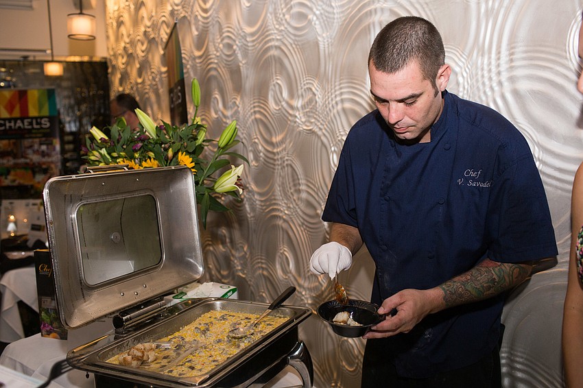 Vincent Savadel from Mattison's prepares the scallop dish.