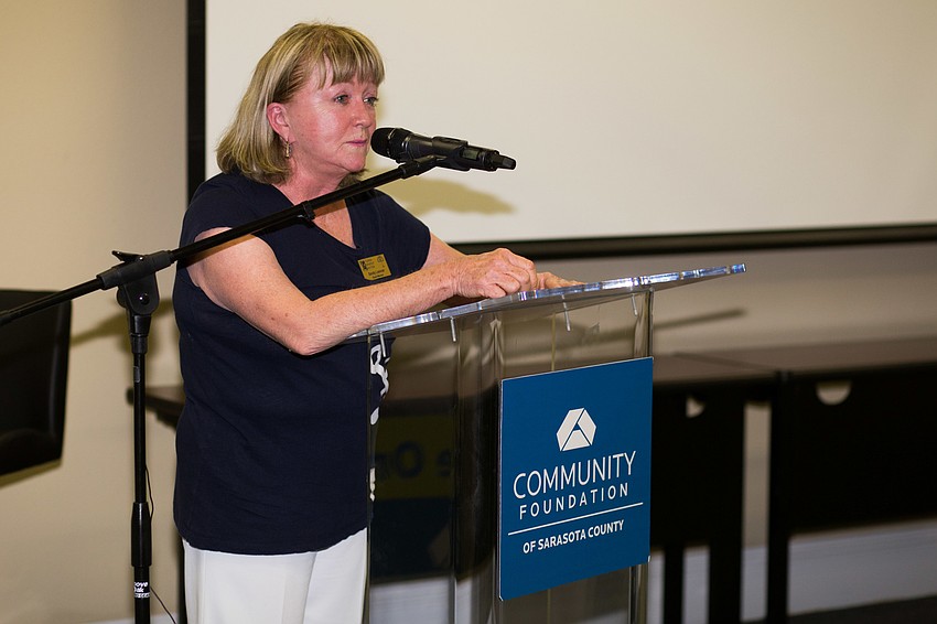 Florida Winefest & Auction Board President Sandy Loevner introduces the program.