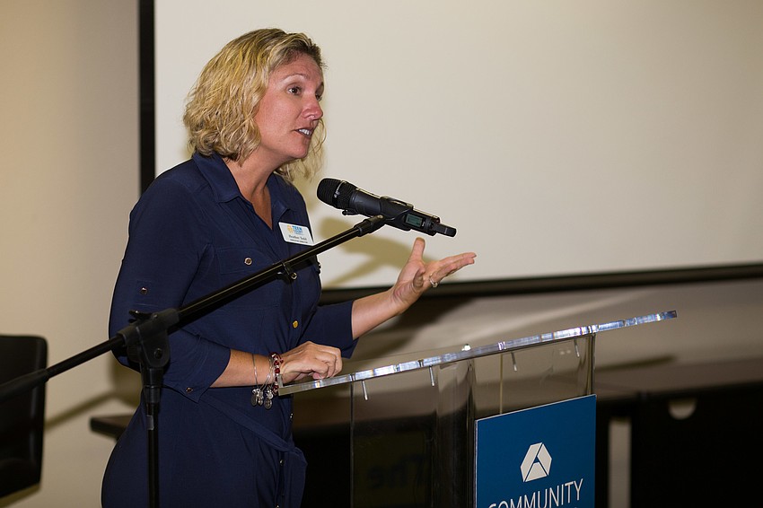 Teen Court Executive Director Heather Todd accepts the grant.