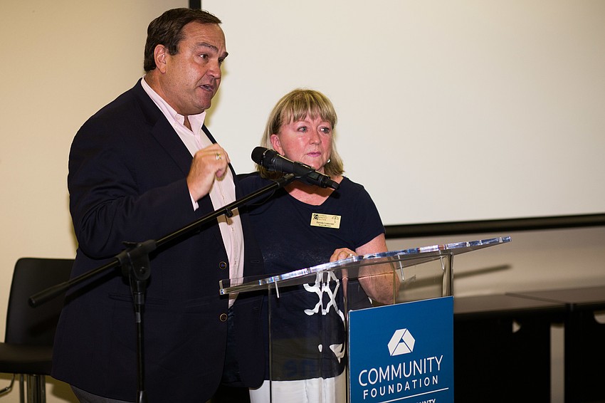 Chip Gaylor tells the audience that the Catlin Foundation is granting each organization an additional $1,500.