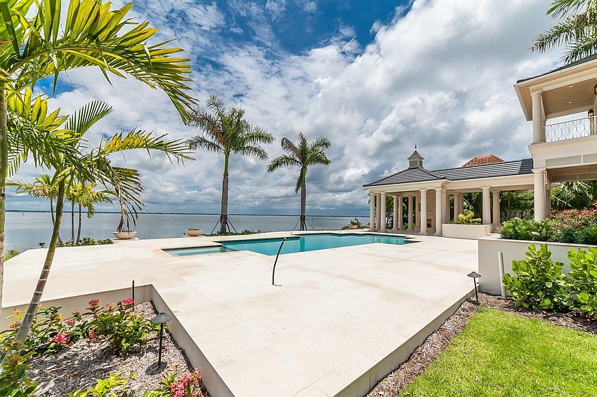The pool and back yard overlook Sarasota Bay.