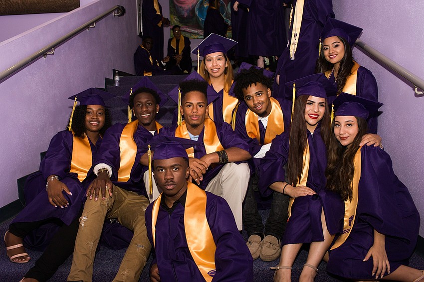 Students wait to line up on the stairs.