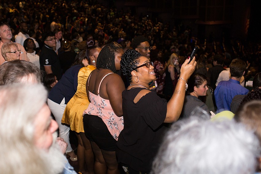 Friends and family took photos of their graduates as they entered the auditorium.
