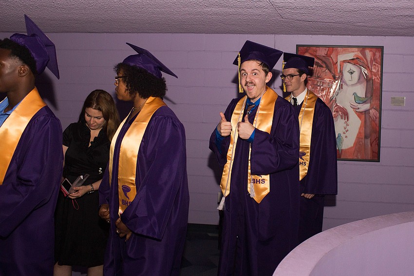 A student poses as he walks in the line up.