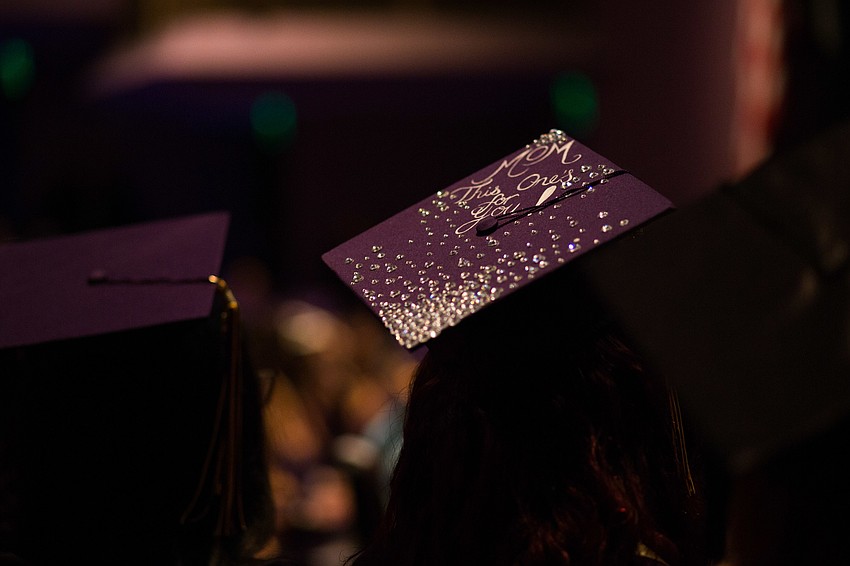 A student's hat is decorated with 