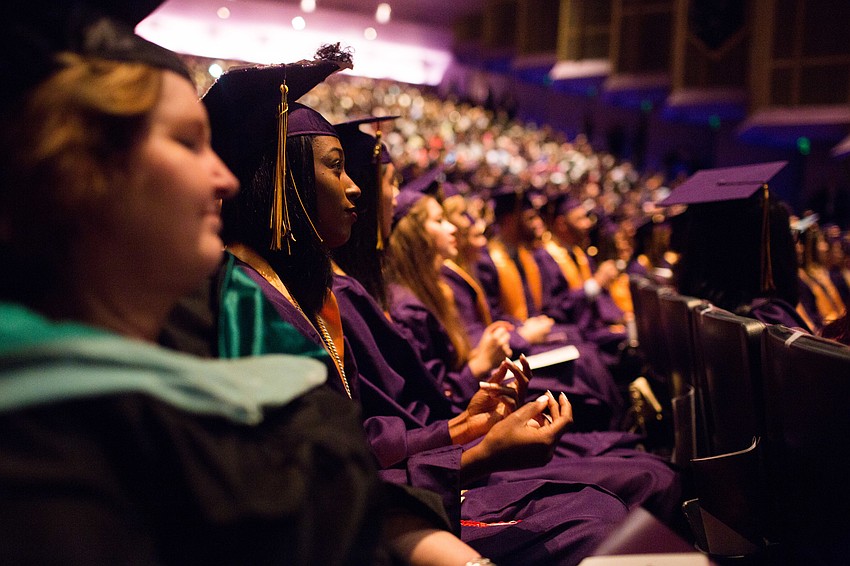 A student snaps along to the music.