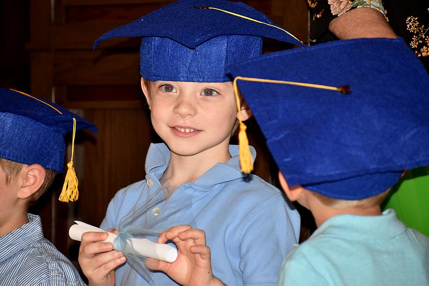 Graduates receive their diplomas.