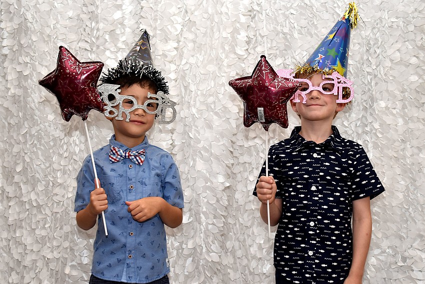 Spencer Jordan and Billy Double test out the photo booth.