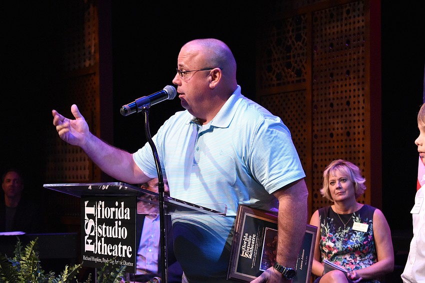 Fruitville Elementary Principal Steven “Dusty” French accepts the Educator of the Year award on behalf of his employee, Lauren Johnson.