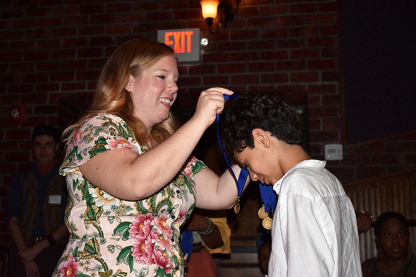 FST Director of Children’s Theatre Caroline Kaiser was one of several FST team members giving out medals.
