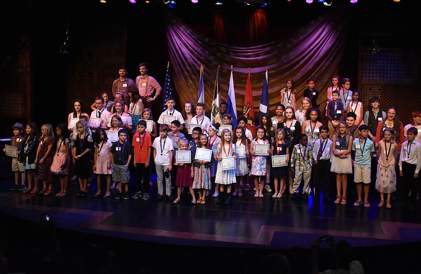 Honorable mention and best play award winners show off their certificates.