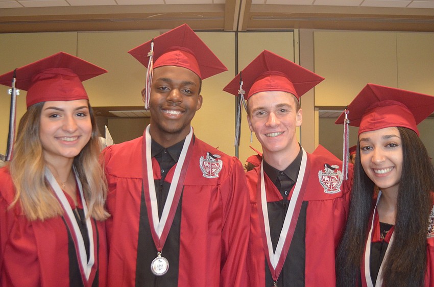 Kalaina Hintze, Kevin Haynes, Austin Hare and Sasha Gray are ready to get their diplomas.