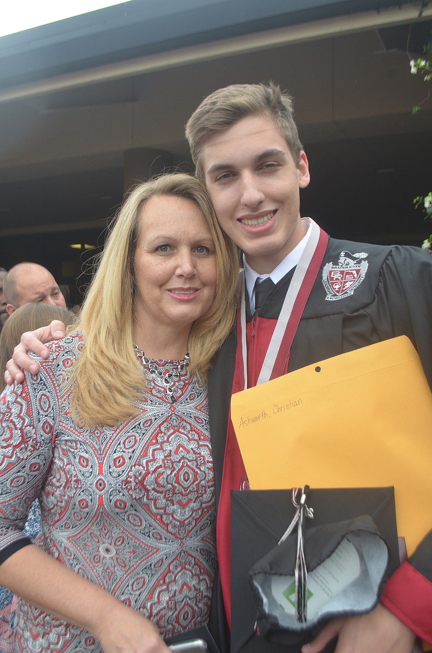 Angela Ashworth and her son, Christian Ashworth, celebrate his accomplishment.