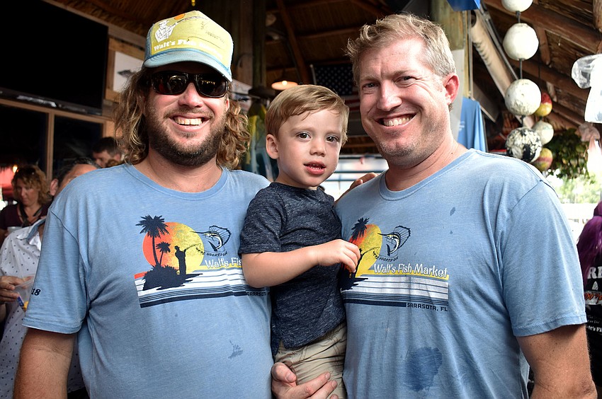 Walt’s Fish Market Owner Brett Wallin with Tommy and Tommy Wallin