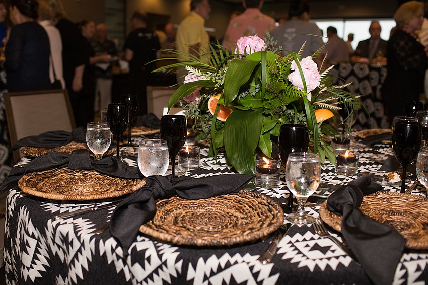 The men decorated their tables for the evening.