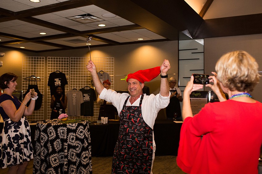 John Scalzi walks to his station, vegetarian chili.