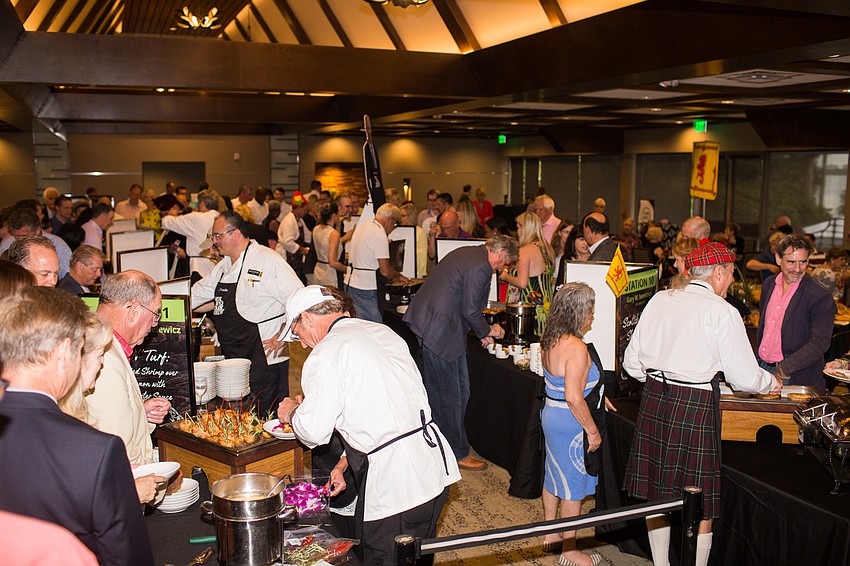 Guests lined up to try each station's dish.
