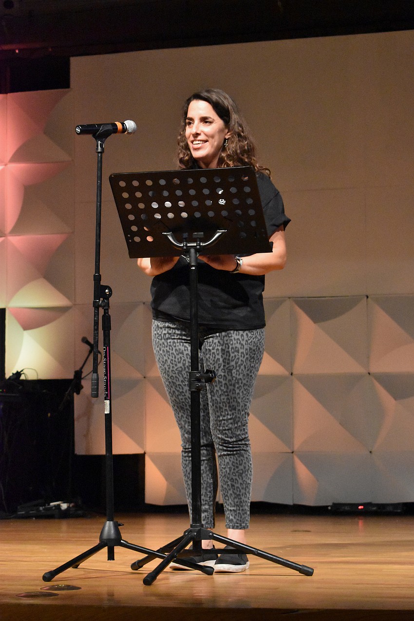 Director Ria Cooper welcomes the crowd.