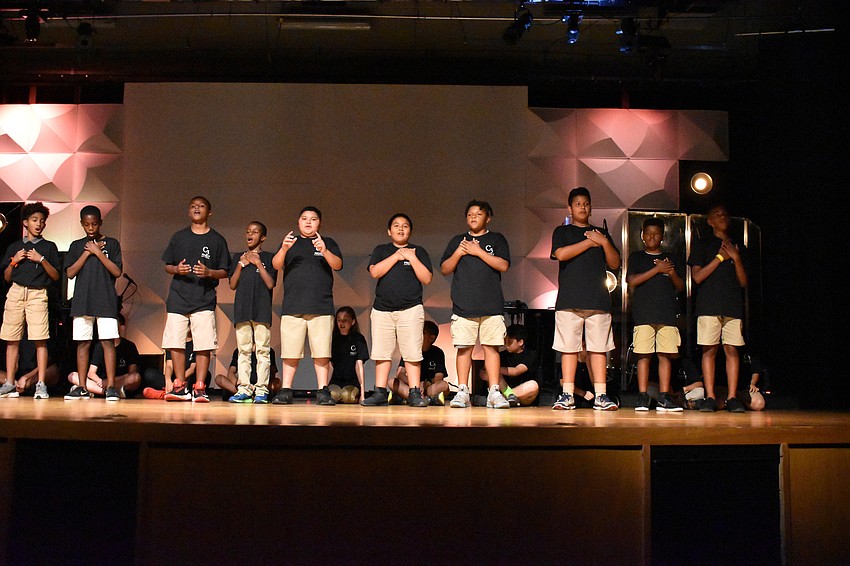 Visible Men Academy students kick off the performance.
