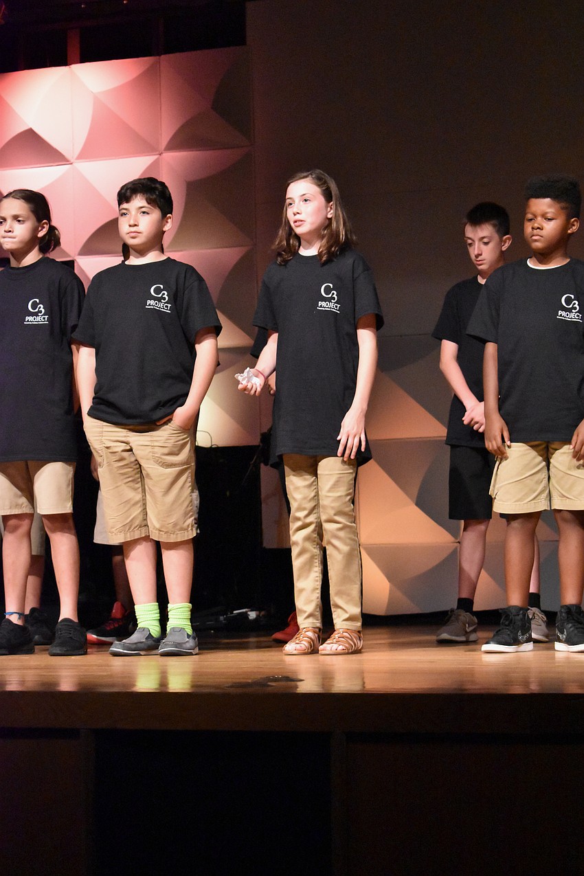 A Community Day student presents her 