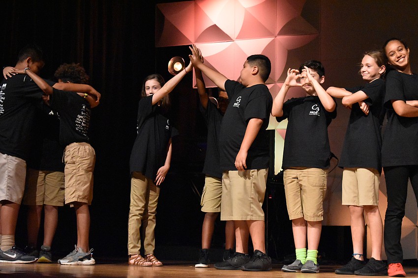 Students act out how they felt about the C3 project by the end of the 12 weeks.