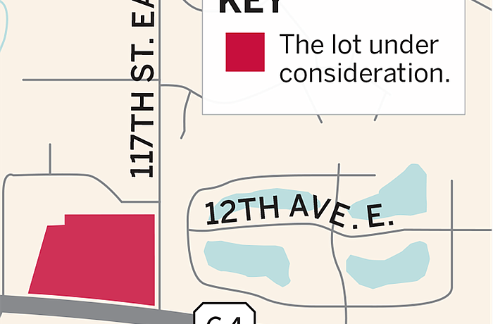 The area marked in red is the property under consideration for development.