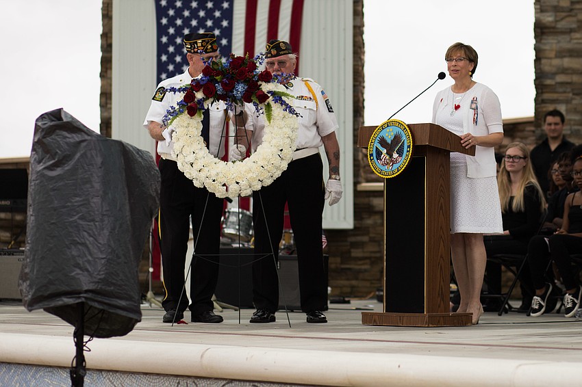 Kim Hayes reads a letter her late son sent her while he was deployed.