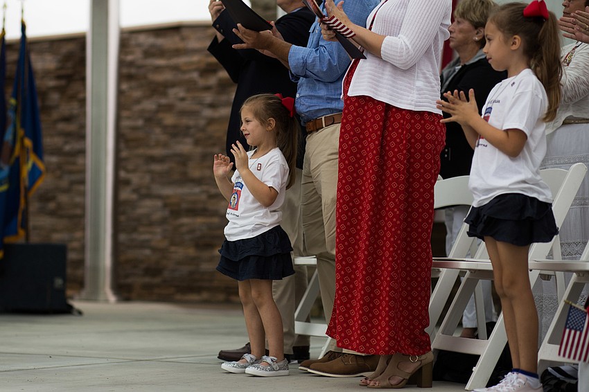 Attendees clap for the speaker.
