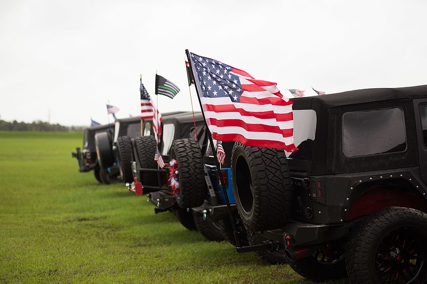 A row of Jeeps were decorated patriotically.