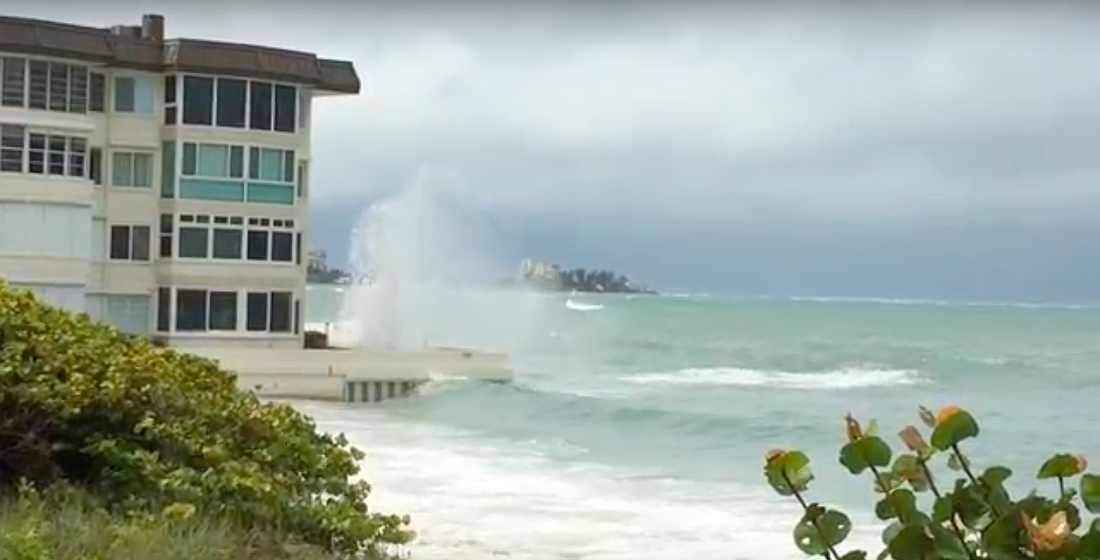 A Lido Key resident took video of waves crashing into the First Lido Condominium building on Sunday. Image courtesy Barbara Lowenthal.