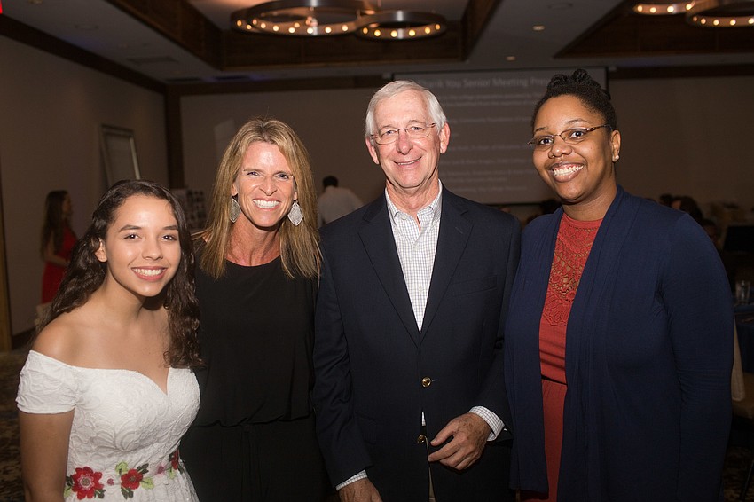 Graudate Suzanne Brown, Executive Director Lisa Bechtold, President Doug Durand and Academic Adviser Andrea Lee