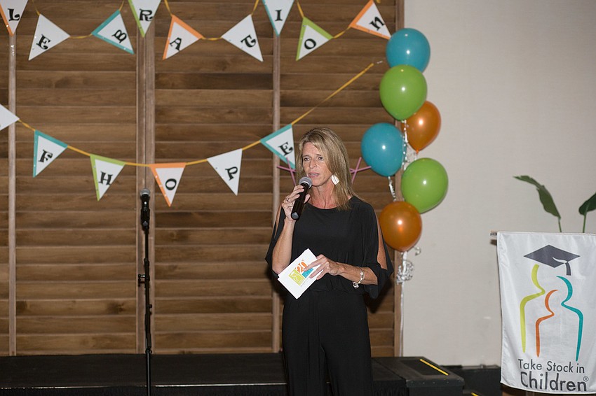 Executive Director Lisa Bechtold encourages the students to continue their hard work.