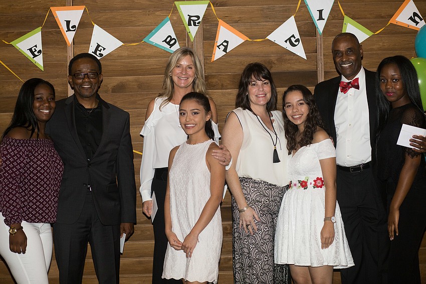 TSIC College Success Coaches with their graduates.