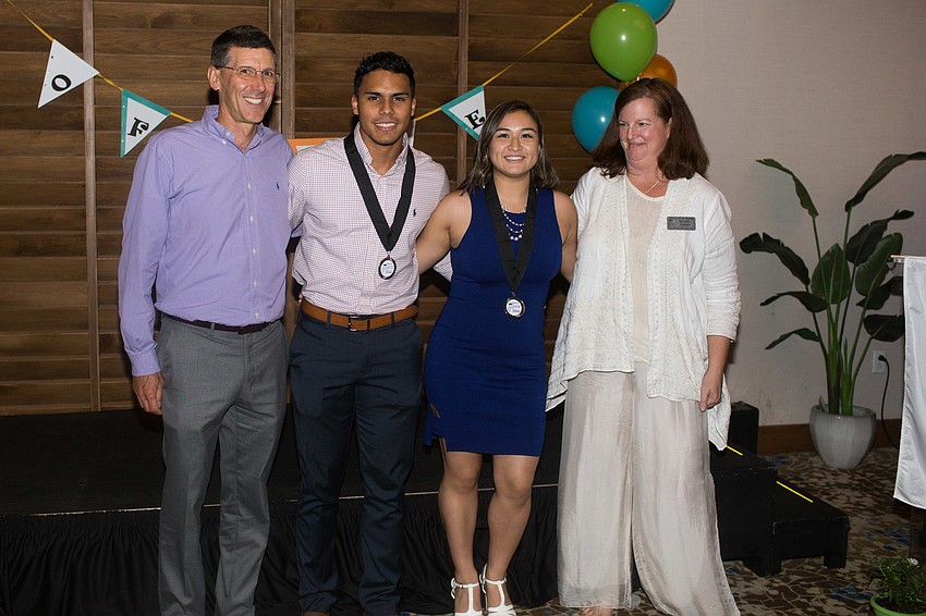 Sarasota Military Academy graduates and their mentors pose for a photo.