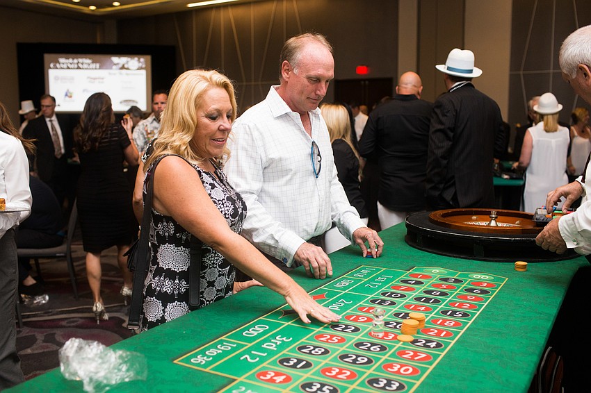 Debi and Eric Reynolds bet on roulette.