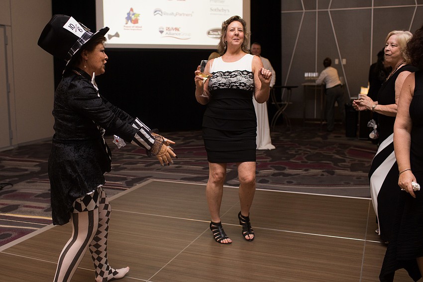 Guests dance on the dance floor.
