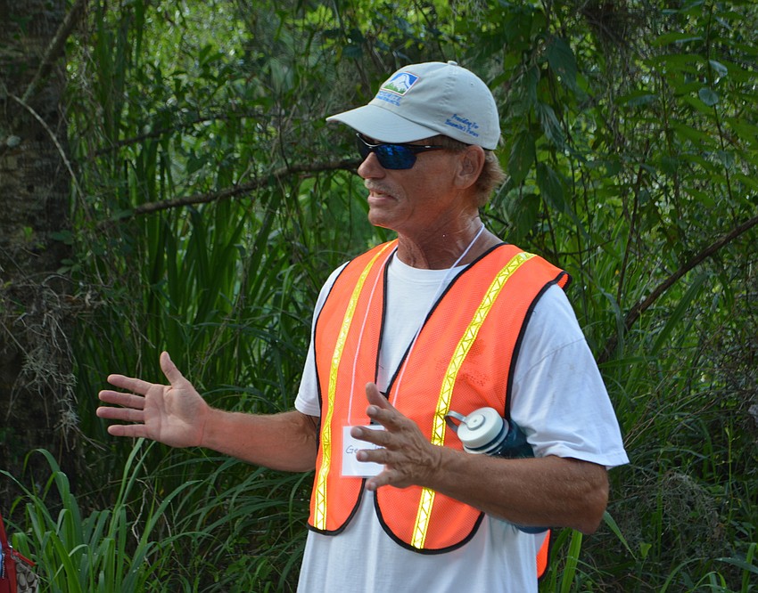 George Tatge, a land manager with the Conservation Foundation of the Gulf Coast, explained some of the natural wonders to those taking the walking tour.