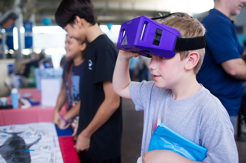 Jacob Hockett tries out the virtual reality glasses.